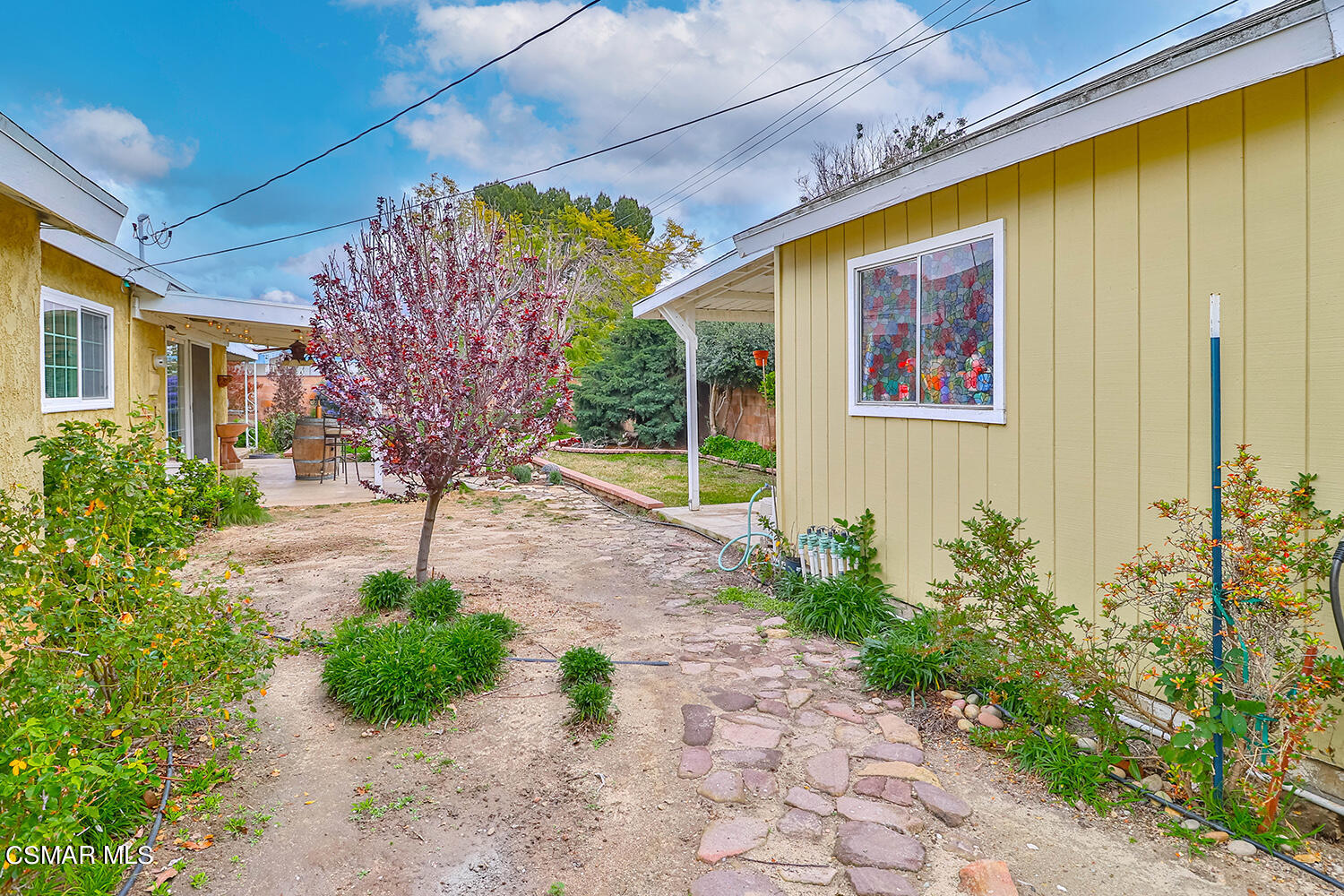 1648 Spence Street Simi Valley, CA 93065 - Photo 40 of 41 a front view of a house with garden