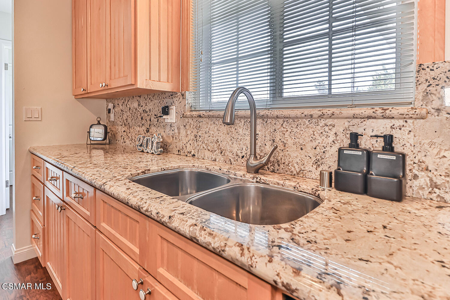 1648 Spence Street Simi Valley, CA 93065 - Photo 7 of 41 a kitchen with granite countertop a sink and a window