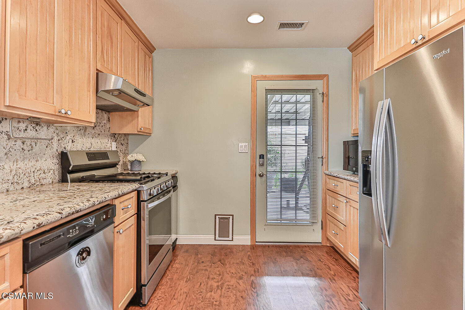 1648 Spence Street Simi Valley, CA 93065 - Photo 8 of 41 a kitchen with stainless steel appliances granite countertop a refrigerator a stove and a sink