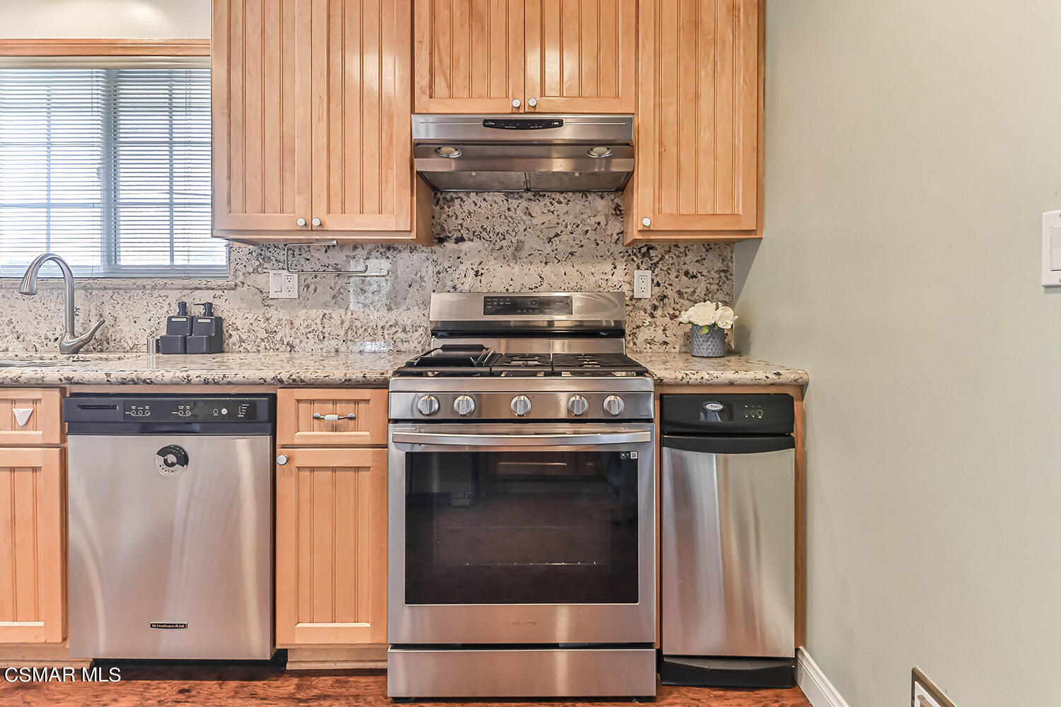1648 Spence Street Simi Valley, CA 93065 - Photo 9 of 41 a kitchen with stainless steel appliances granite countertop a stove a sink and a microwave