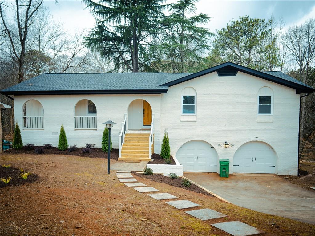 2263 Chevy Chase Lane Decatur, GA 30032 - Photo 1 of 1 a front view of a house with a yard and garage