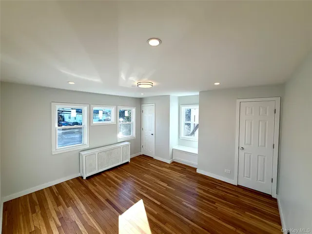 wooden floor in an empty room with window