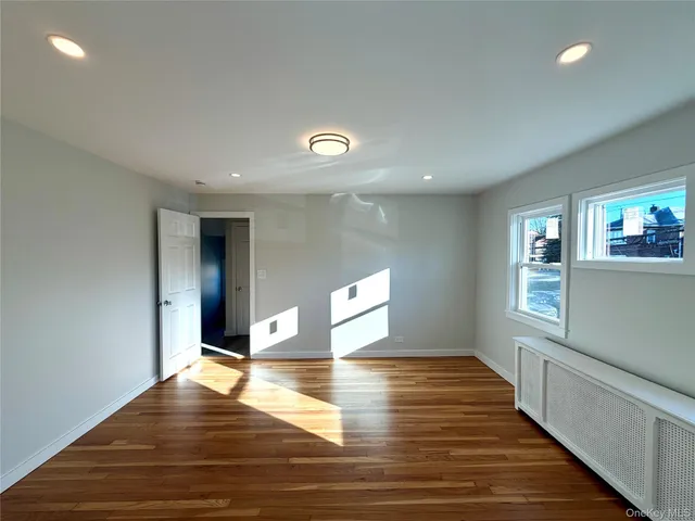 a view of a livingroom with wooden floor