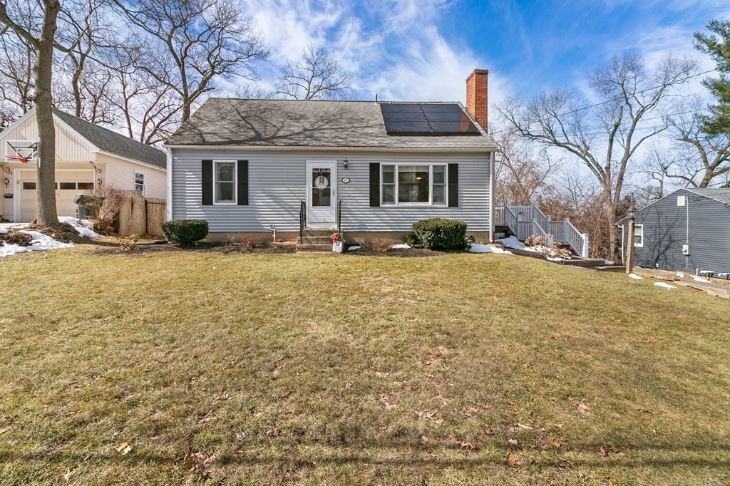a front view of a house with a yard