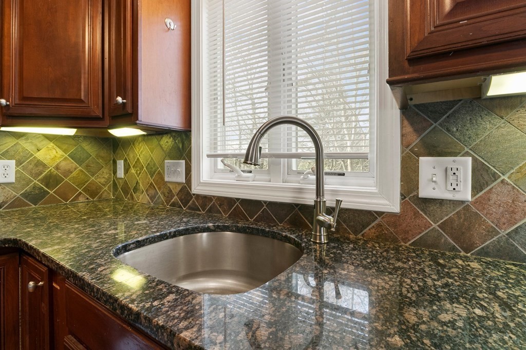 190 West Allen Ridge Road Springfield, MA 01118 - Photo 12 of 39 a kitchen with a sink a counter top and cabinets