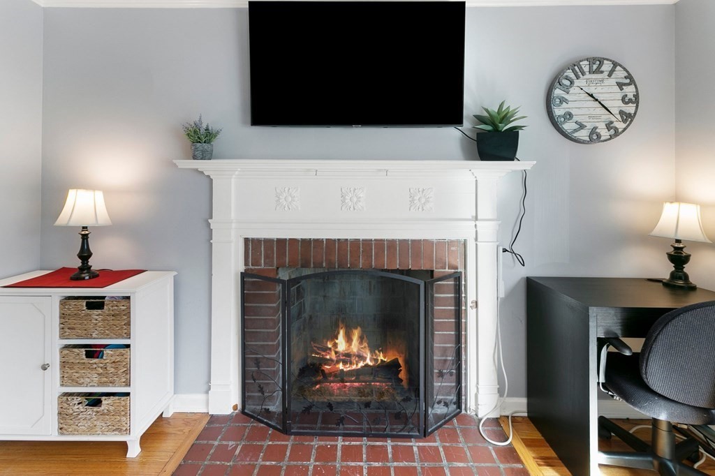 190 West Allen Ridge Road Springfield, MA 01118 - Photo 16 of 39 a living room with furniture a fireplace and a flat screen tv