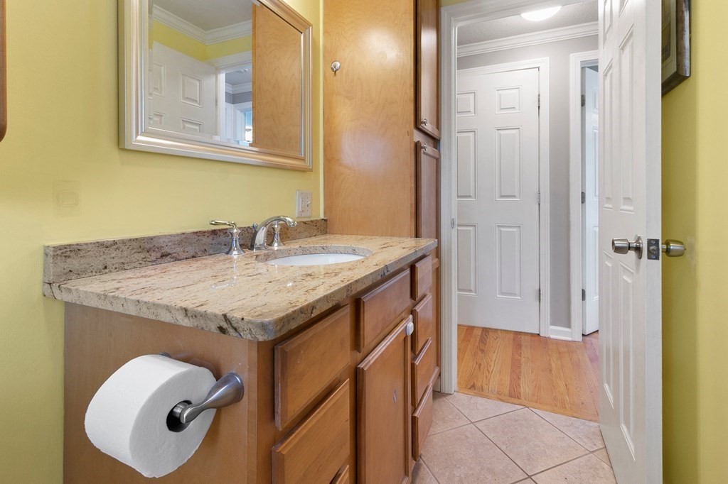 190 West Allen Ridge Road Springfield, MA 01118 - Photo 18 of 39 a bathroom with a granite countertop sink and mirror