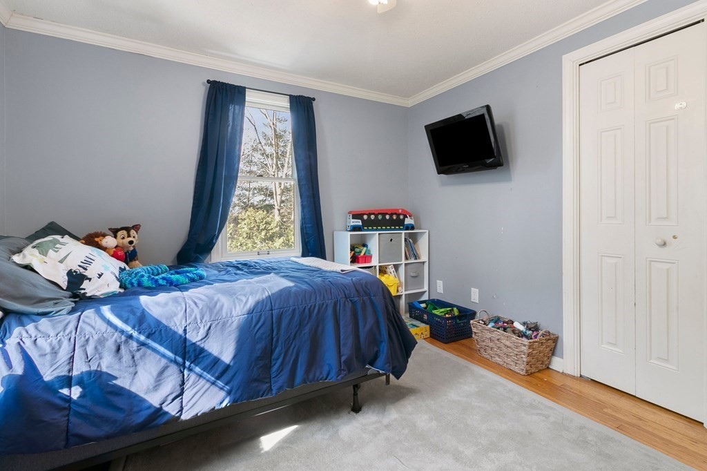 190 West Allen Ridge Road Springfield, MA 01118 - Photo 21 of 39 a bedroom with a bed and flat screen tv