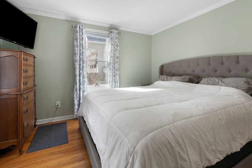 190 West Allen Ridge Road Springfield, MA 01118 - Photo 24 of 39 a bedroom with a bed and a flat screen tv