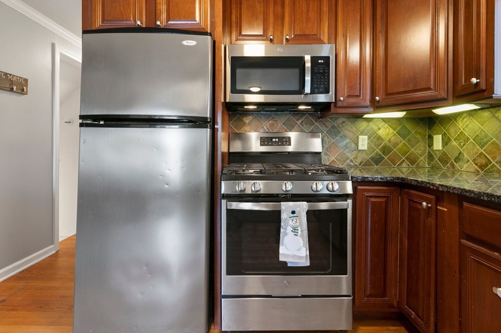 190 West Allen Ridge Road Springfield, MA 01118 - Photo 10 of 39 a kitchen with stainless steel appliances granite countertop a refrigerator a stove a sink and dishwasher