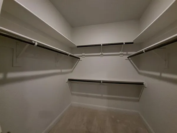 a view of an empty walk in closet