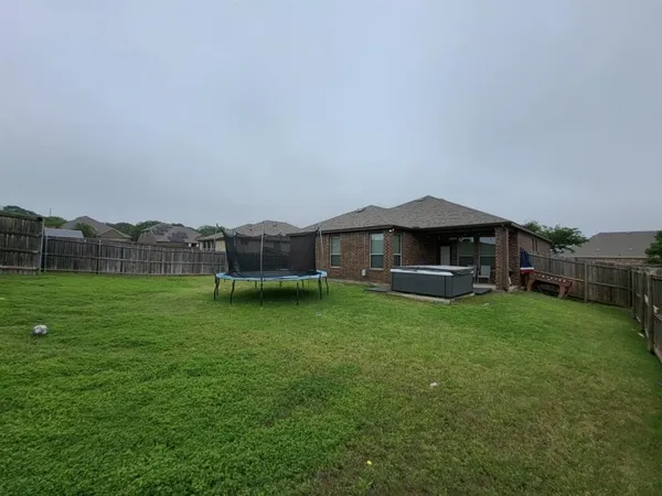a house view with a garden space