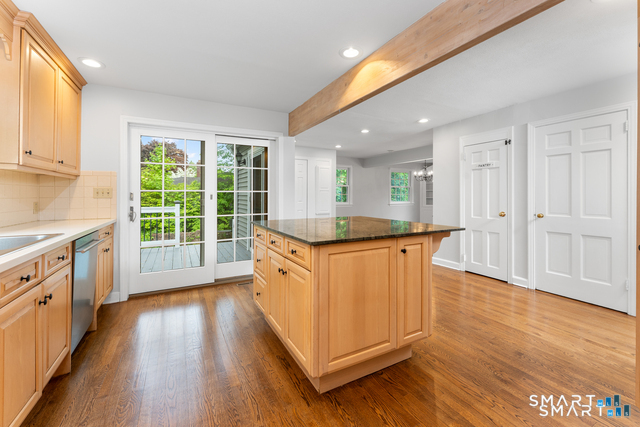 62 Chatham Road Berlin, CT 06037 - Photo 8 of 38 a kitchen with wooden floors and white walls