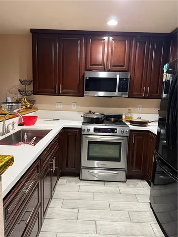 a kitchen with a stove and a sink