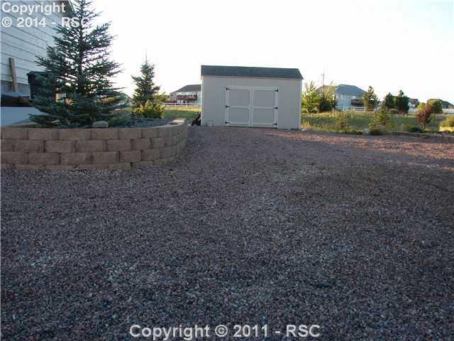 8236 Tipperary Road Peyton, CO 80831 - Photo 15 of 16 This shed is in addition to the three-car garage! This home has everything -- including central A/C and two fireplaces!