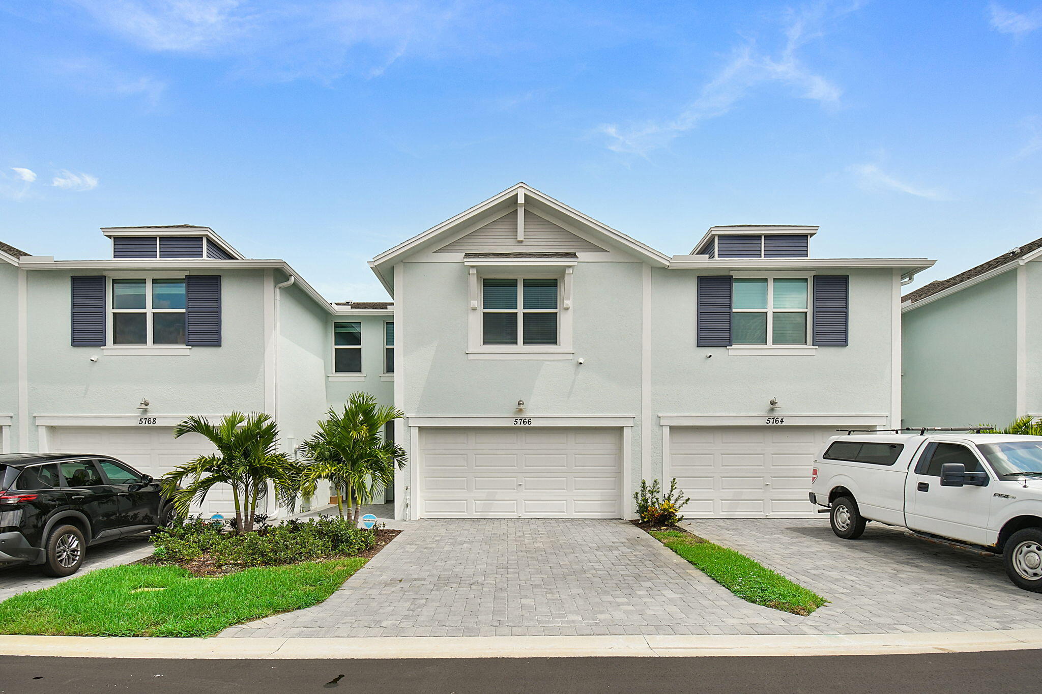 5766 Southeast Edgewater Circle Stuart, FL 34997 - Photo 2 of 41 Front of Town Home with Paver Driveway