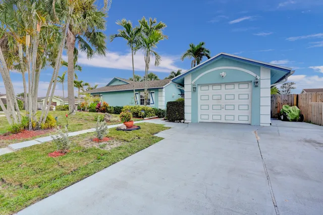 a view of a dining room with furniture and a window