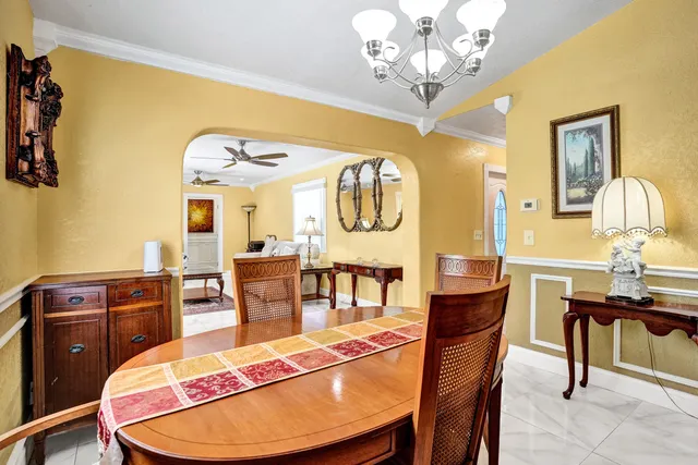 a living room with furniture a rug and a large window