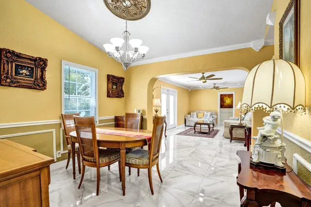 a bedroom with furniture and a rug