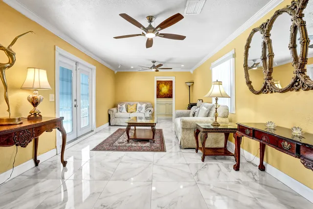 an aerial view of residential houses with outdoor space and parking