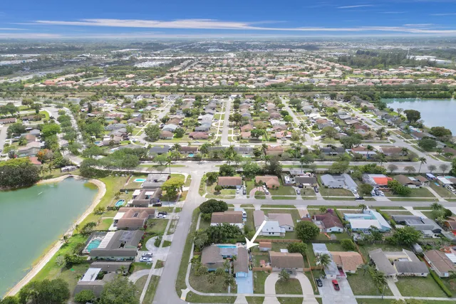 a view of a swimming pool with a yard