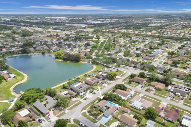 a bathroom with a shower sink and mirror