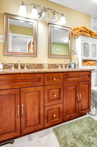 a bathroom with a shower a toilet and a sink