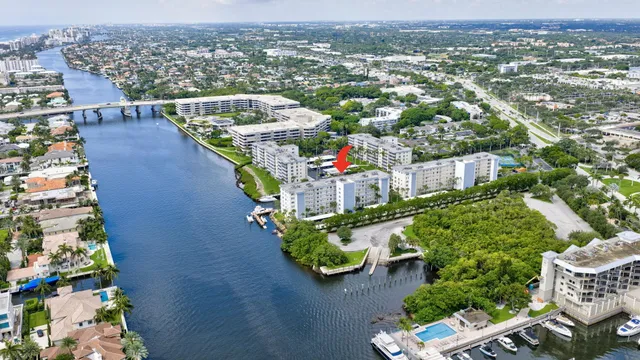 an aerial view of a house with a yard basket ball court and outdoor seating