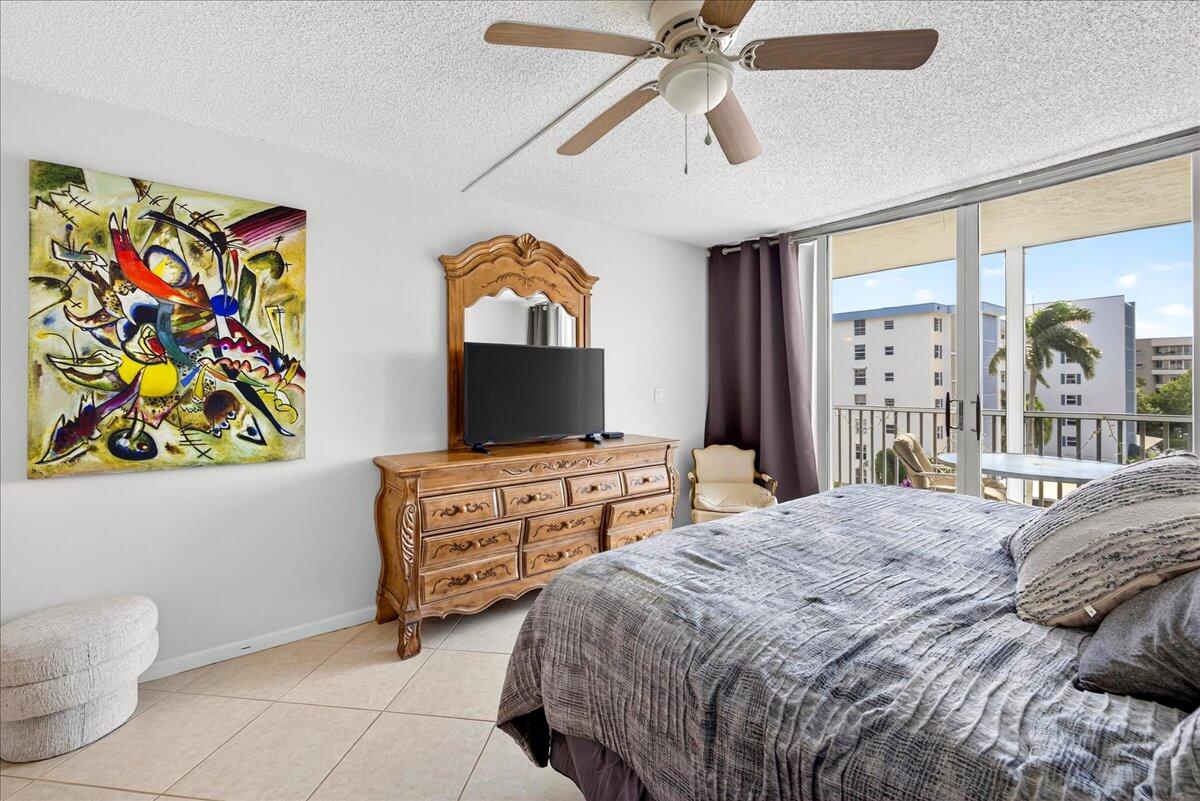 1 Harbourside Drive, Unit 3505 Delray Beach, FL 33483 - Photo 14 of 38 a bedroom with a bed and a flat screen tv