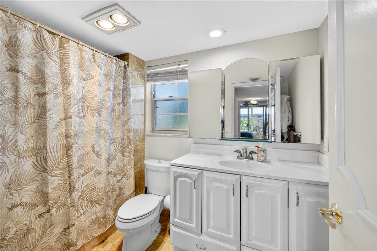 1 Harbourside Drive, Unit 3505 Delray Beach, FL 33483 - Photo 15 of 38 a bathroom with a sink toilet and shower