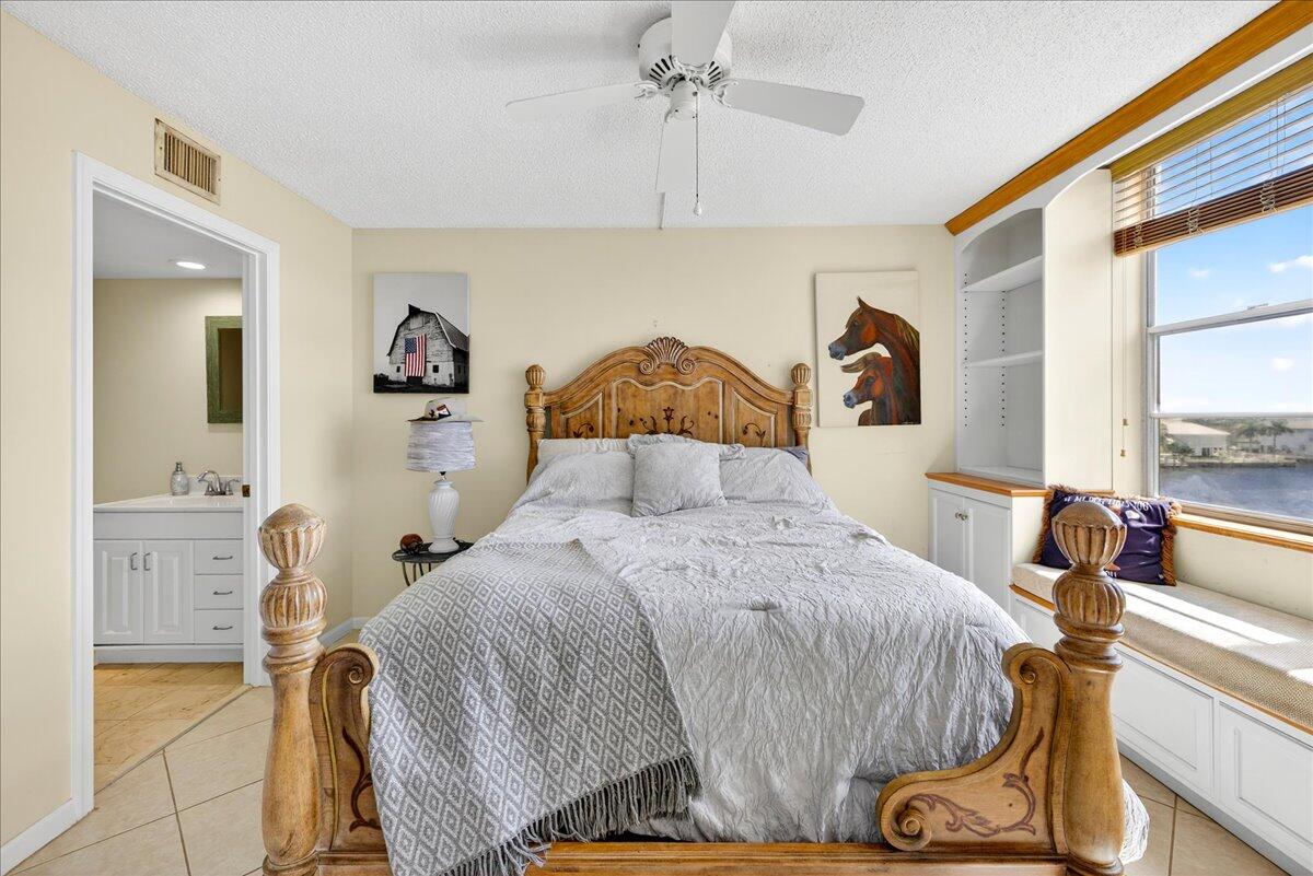 1 Harbourside Drive, Unit 3505 Delray Beach, FL 33483 - Photo 16 of 38 a bedroom with a bed and wooden floor