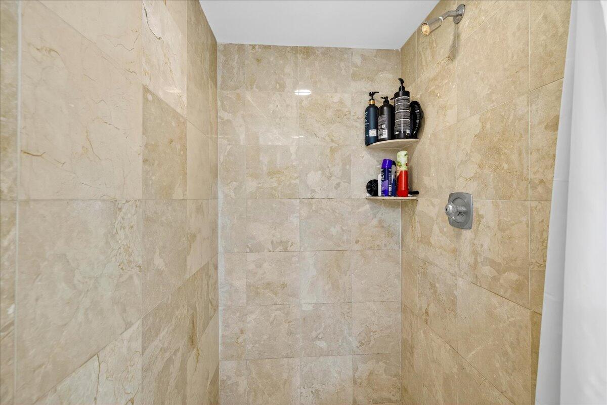 1 Harbourside Drive, Unit 3505 Delray Beach, FL 33483 - Photo 19 of 38 a bathroom with a shower