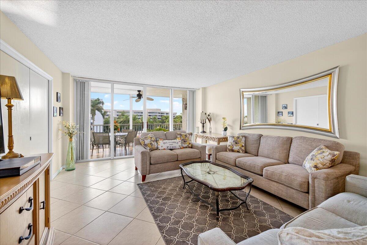 1 Harbourside Drive, Unit 3505 Delray Beach, FL 33483 - Photo 4 of 38 a living room with furniture and a large window