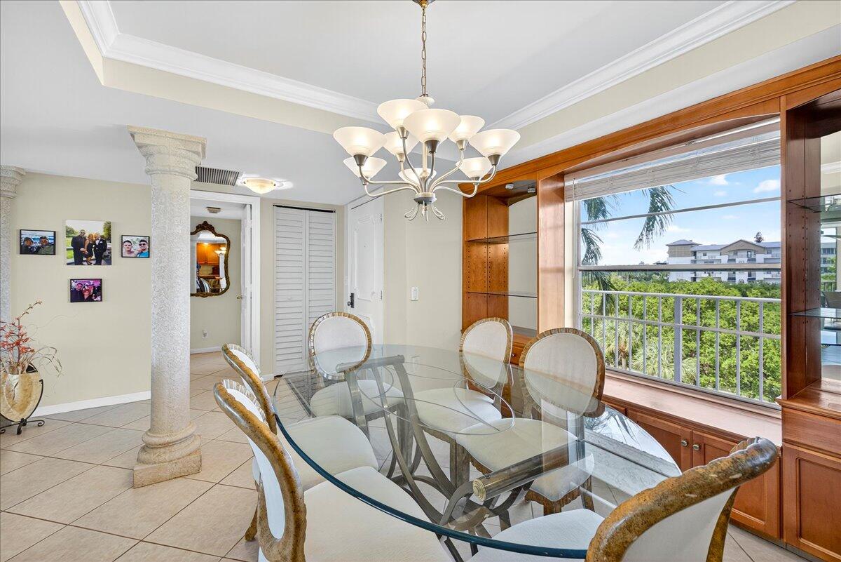 1 Harbourside Drive, Unit 3505 Delray Beach, FL 33483 - Photo 7 of 38 a dining room with wooden floor a chandelier a glass table and chairs