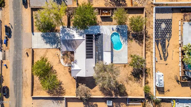 front view of a house with a tree