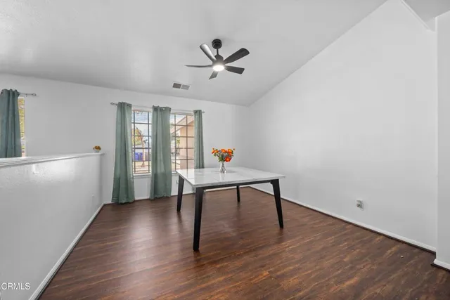 a view of a livingroom with furniture and wooden floor