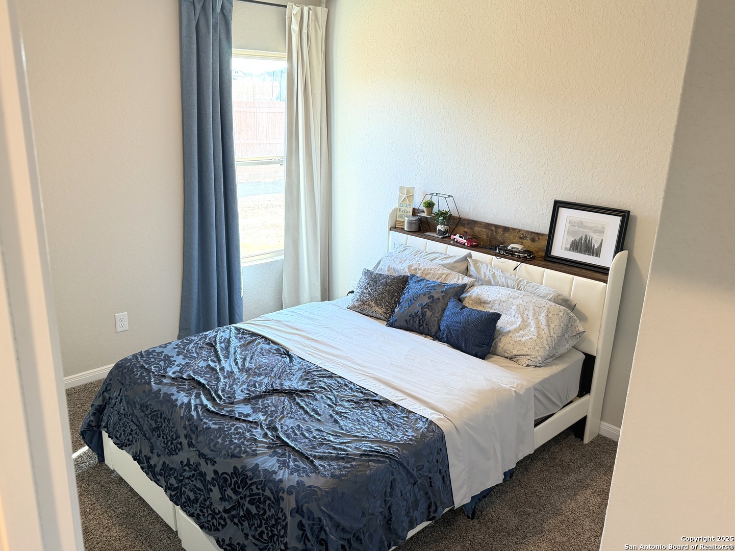 20929 Pleasanton Road San Antonio, TX 78264 - Photo 30 of 51 a bedroom with a bed and a window