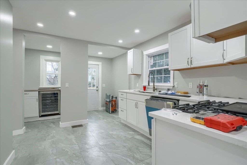 25 Patterson Street Boston, MA 02124 - Photo 16 of 32 a kitchen with a sink stove and cabinets