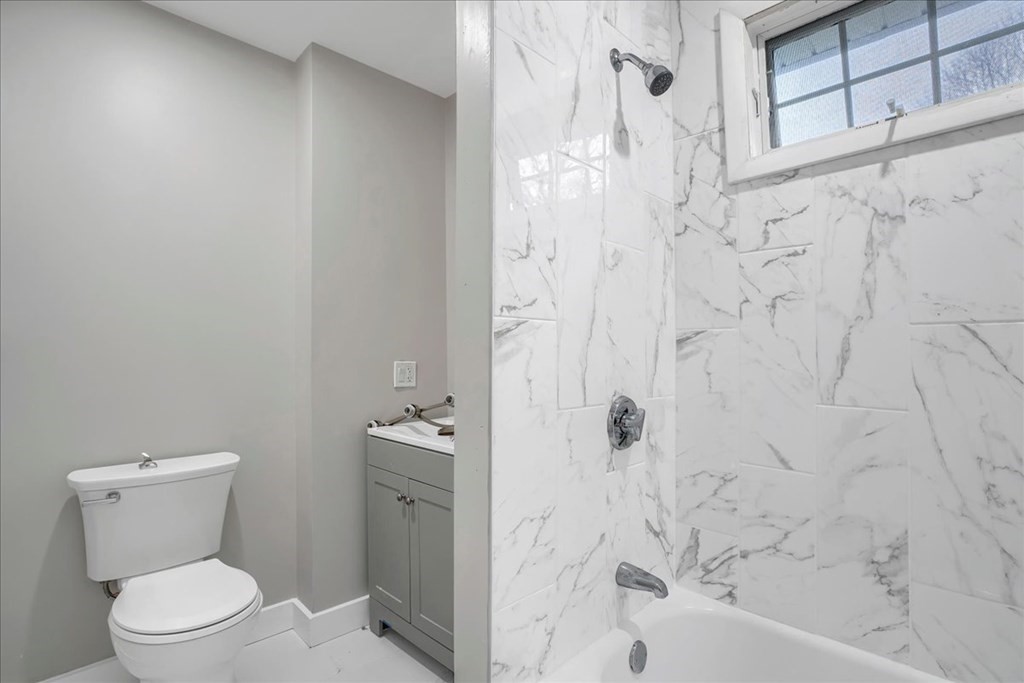 25 Patterson Street Boston, MA 02124 - Photo 17 of 32 a bathroom with a toilet and shower