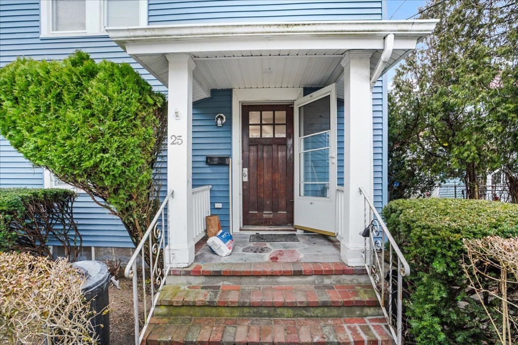 25 Patterson Street Boston, MA 02124 - Photo 2 of 32 a front view of a house with a garden