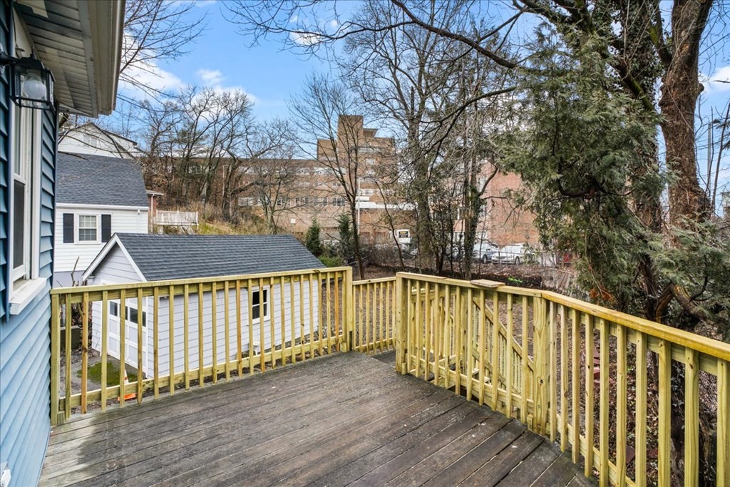 25 Patterson Street Boston, MA 02124 - Photo 28 of 32 a view of a wooden balcony with large trees