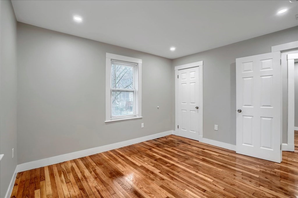 25 Patterson Street Boston, MA 02124 - Photo 9 of 32 a view of a room with wooden floor and window