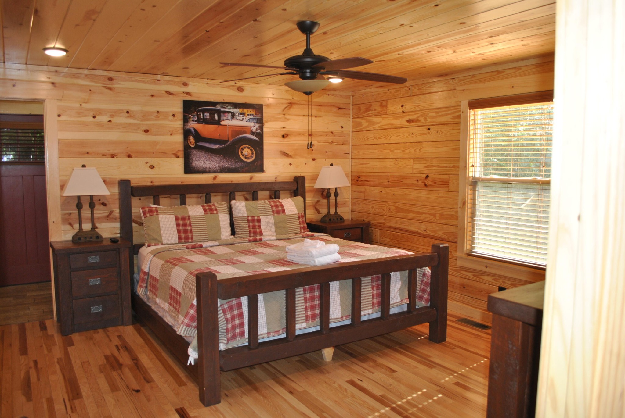 222 Forrest Loop Way Gatlinburg, TN 37738 - Photo 5 of 17 a bedroom with a bed and wooden floor