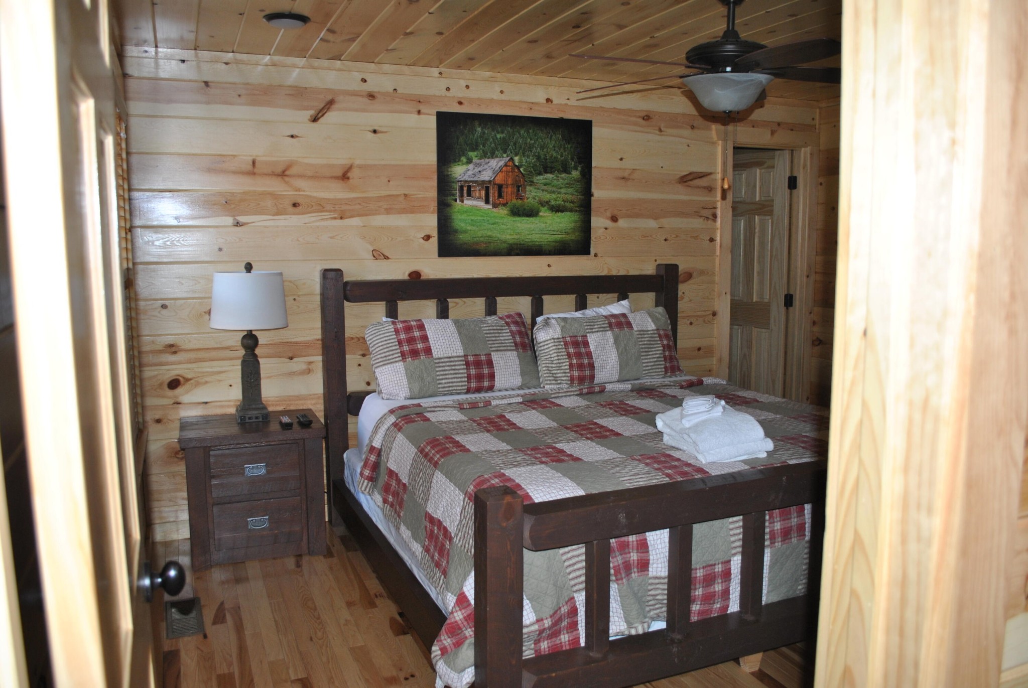 222 Forrest Loop Way Gatlinburg, TN 37738 - Photo 6 of 17 a bedroom with a bed and a flat screen tv