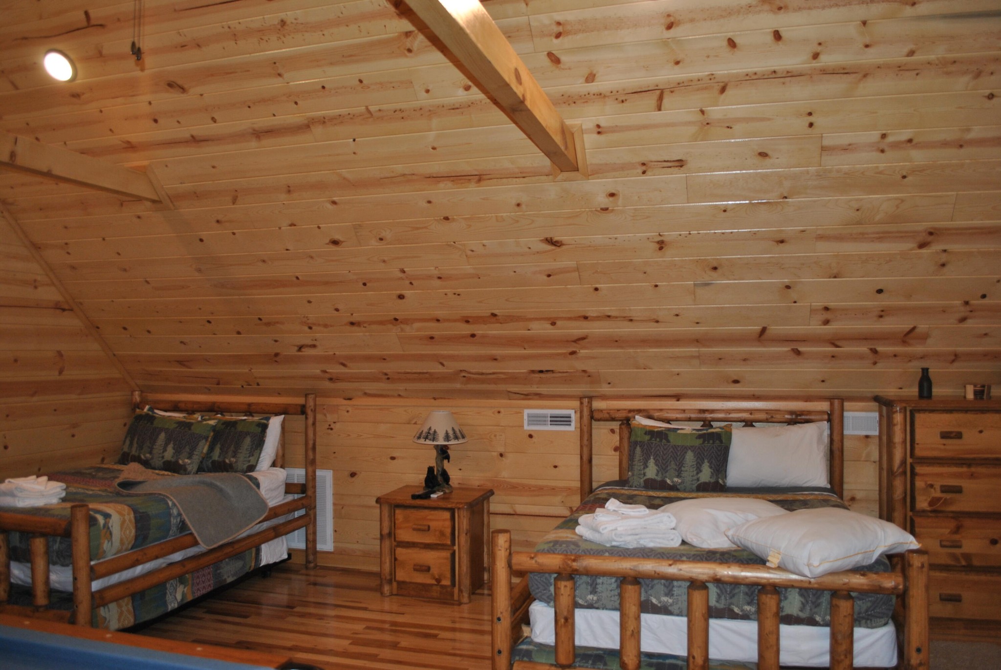 222 Forrest Loop Way Gatlinburg, TN 37738 - Photo 8 of 17 a bedroom with a bed and wooden floor