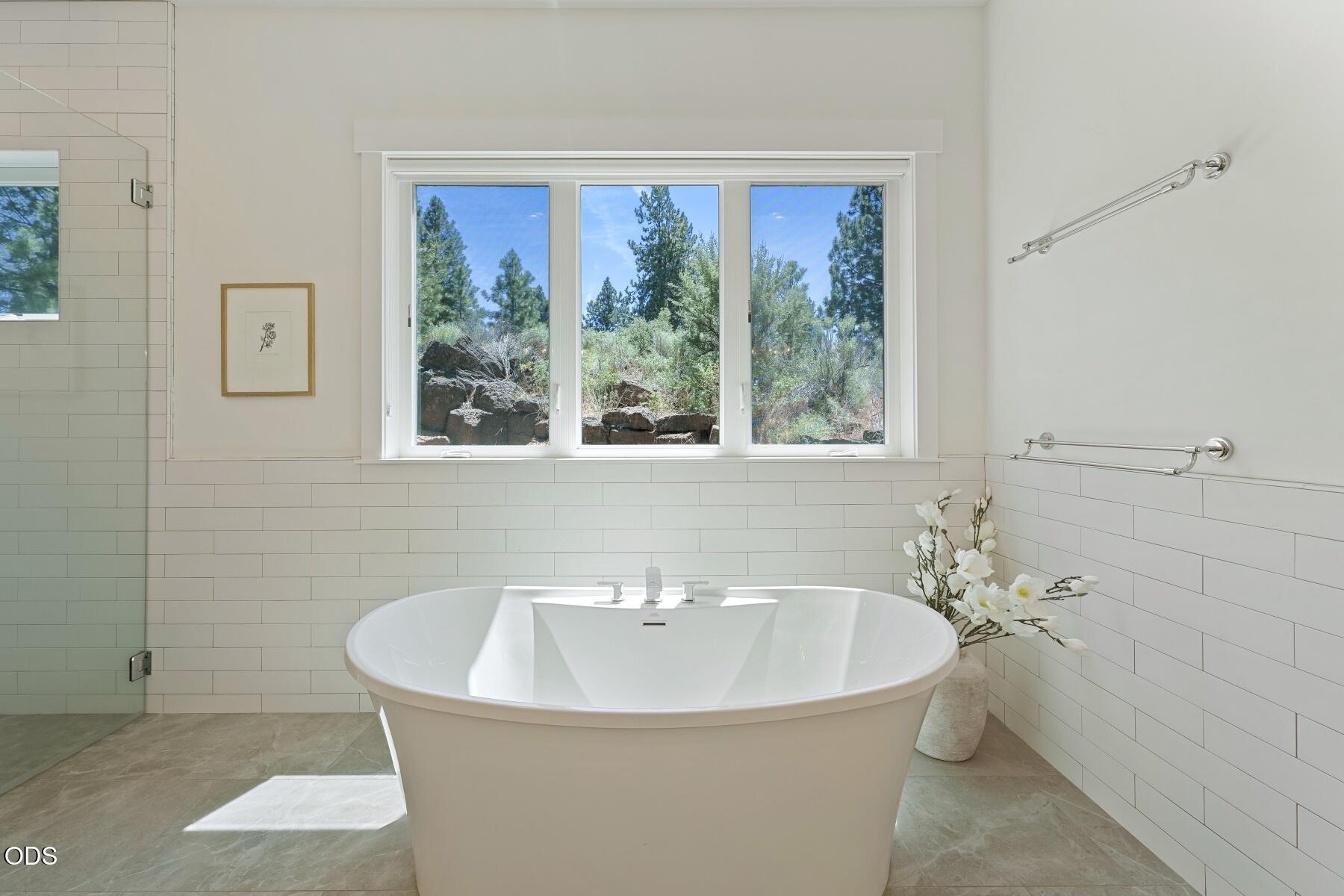 60255 Sunset View Drive Bend, OR 97702 - Photo 22 of 48 a white bath tub sitting next to a white sink