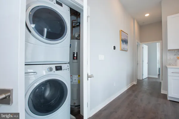 a view of a hallway with washer and dryer