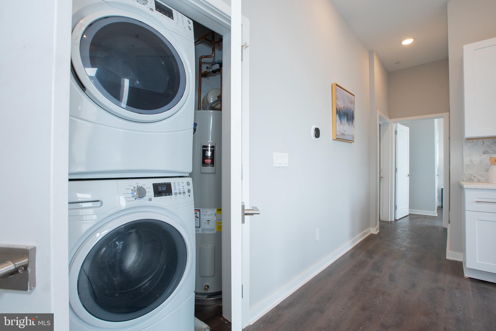 1534 Ridge Avenue, Unit 301 Philadelphia, PA 19130 - Photo 13 of 16 a view of a hallway with washer and dryer