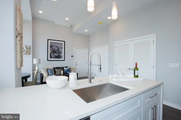 a kitchen with a sink and a refrigerator