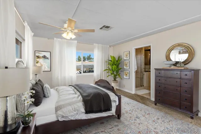 a bedroom with a bed and a dresser